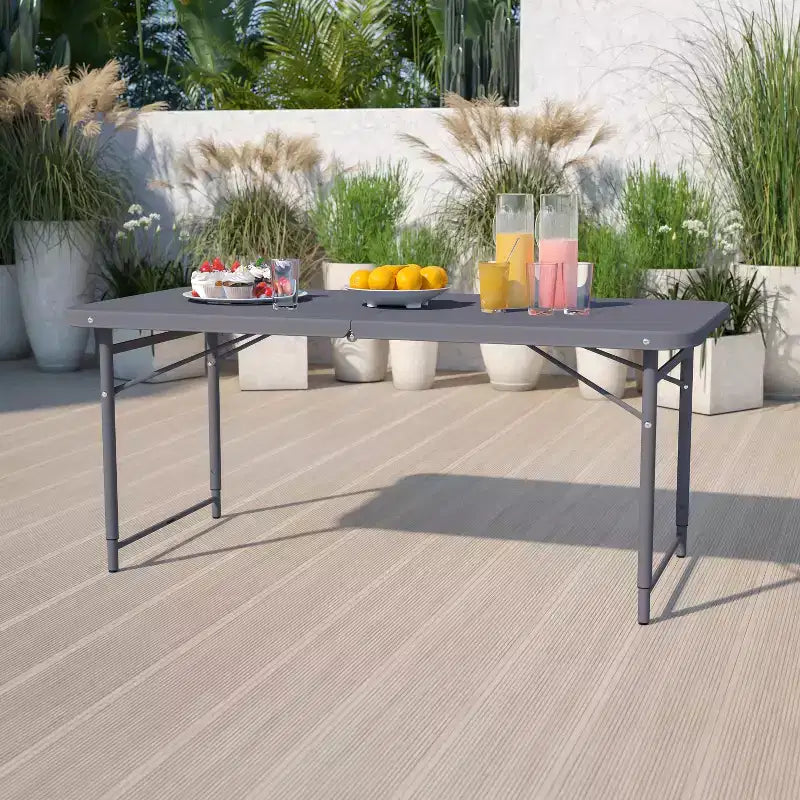 Table pliante en plastique gris foncé, réglable en hauteur (1,2 m), avec poignée